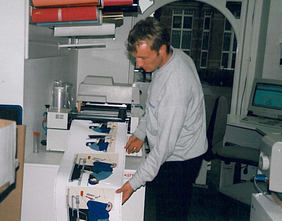 Andy Simpson in producing signage circa 1996