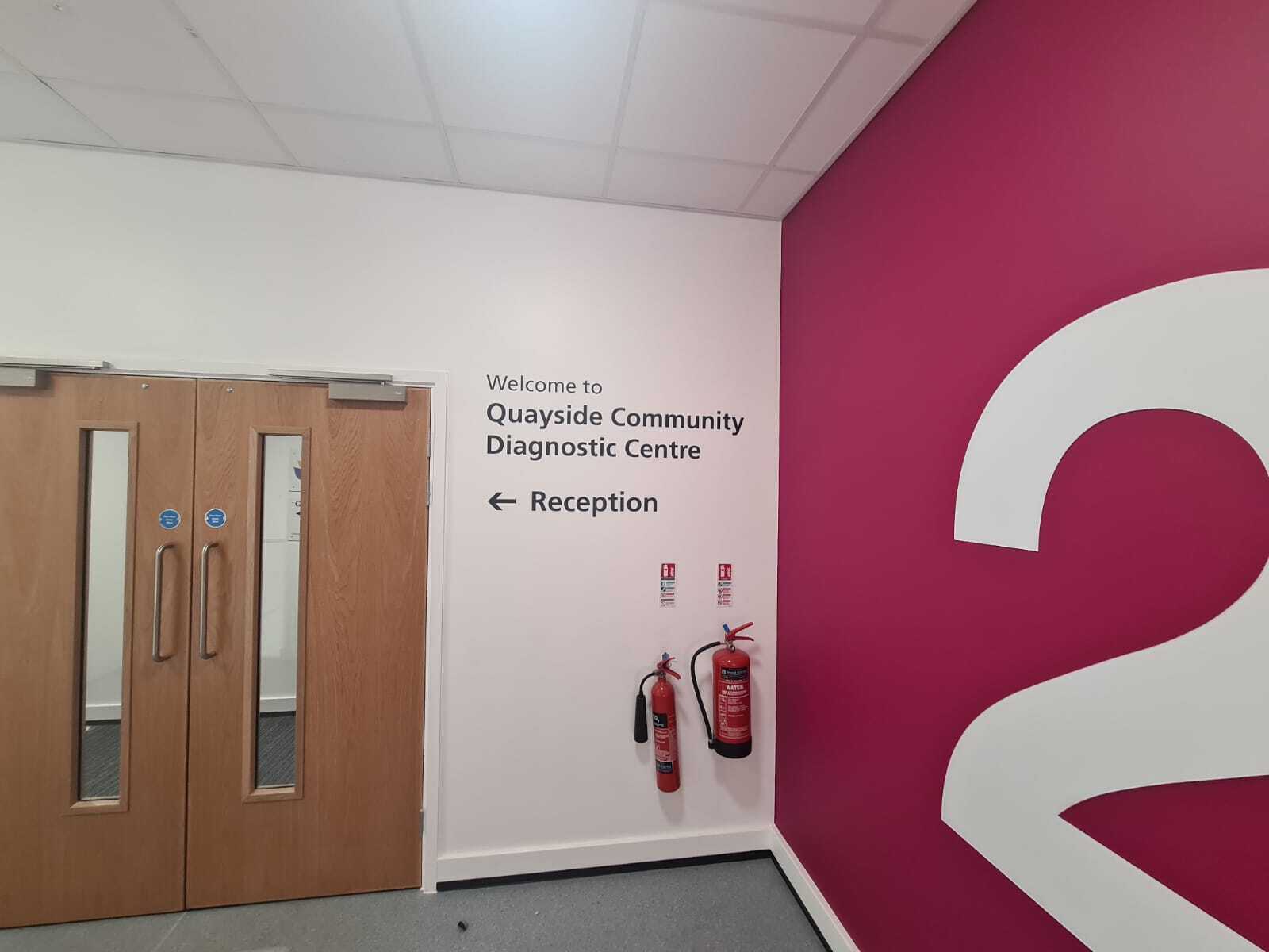 Clear wayfinding signage helps patrons in healthcare facilities navigate busy locations easily.  